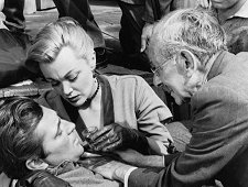 Robert Mitchum, Jan Sterling, Florenz Ames (as Doc Hughes) in the Western "Man with the Gun" (1955).