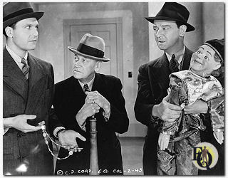 Ralph Bellamy (Ellery Queen), Charley Grapewin and James Burke (Sgt.Velie) in a scene from "The Penthouse Mystery" (1941).