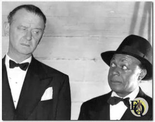 James Burke with Eddie "Rochester" Anderson in an unknown scene (Probably from 1945's "I Love a Bandleader").