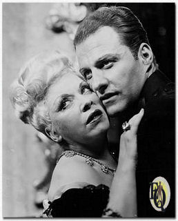 Richard Coogan as Captain Cummings and Mae West as the title role in "Diamond Lil".
