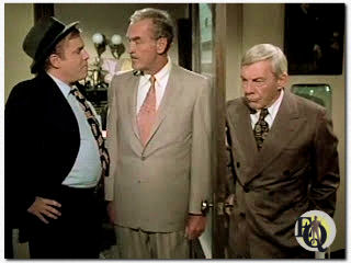 Ken Swofford (Frank Flannigan), Arch Johnson (Deputy Commissioner Hayes), David Wayne (Inspector Richard Queen) in "Ellery Queen" (NBC, 1975-1976).