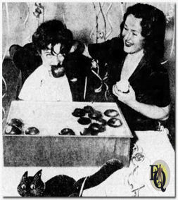 At Joyce's Party - This is a scene from a Halloween party given by no less a person than Columbia network's Ann Shepherd, who plays the part of "Joyce Jordan - Girl Interne" over CBS-KWKH. That's Joyce bobbing up with an apple in her teeth; Kaye Brinker another CNS actress stands by and prepares to dunk Joyce again for good measure. (The Times, Nov 16. 1941)