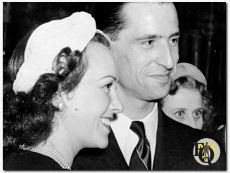 To the Hawaiian Blossom Room recently came Margaret Lindsay, film actress. Her escort was Captain François Polart, test pilot of the French Air Commission over-seeing production of military aircraft now under construction at the Douglas and North American plants. They are pictured dancing together. (1940)