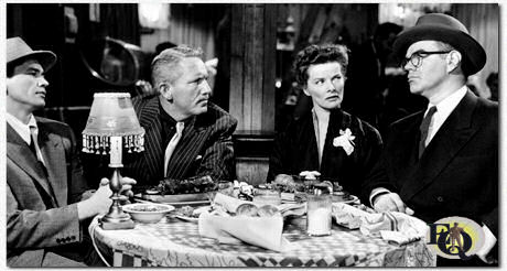 In "Pat and Mike" (MGM, 5 jun 1952) speelde Charles Bronson (aangeduid als Charles Buchinski) samen met George Mathews twee would-be schurken. (L-R) Bronson was ronduit grappig en leek zich helemaal thuis te voelen. In een van de eerste scènes worden Bronson en Mathews gedwongen om melk te drinken terwijl ze onderhandelen met Tracy en Hepburn. Zonder succes vertrekken de gangsters en Bronson vraagt om vergiffenis omdat hij zijn melk niet opdrinkt omdat ik er “winderig van word”.