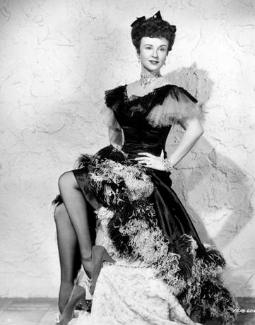 Margaret Lindsay is cast as a sultry Gay Nineties showgirl in Universal's "Vigilantes Return," exciting saga of the Montana frontier (1947).