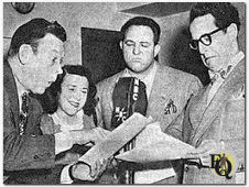 Fred Allen (L) with three of the Alley demimonde (L-R) Minerva Pious, Alan Reed and Kenny Delmar.