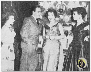 A televised scene from The Adventures of Ellery Queen. In the centre is Hugh Marlowe who plays the title role.